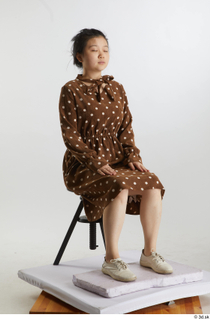 Aera  1 brown dots dress casual dressed sitting white…